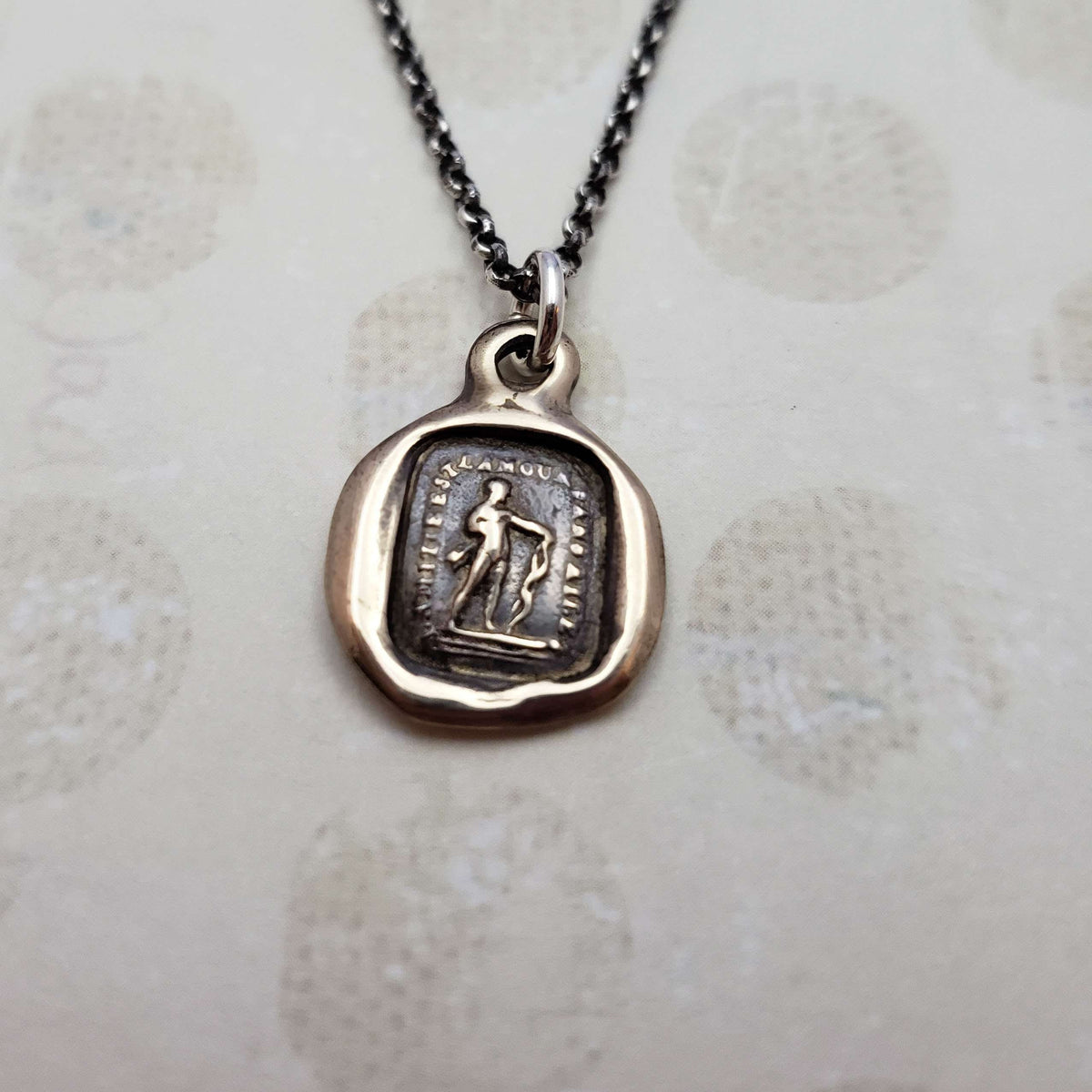 Friendship is love without his wings in bronze