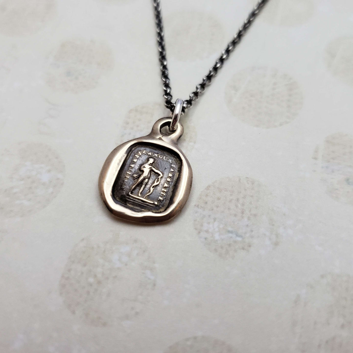 Friendship is love without his wings in bronze