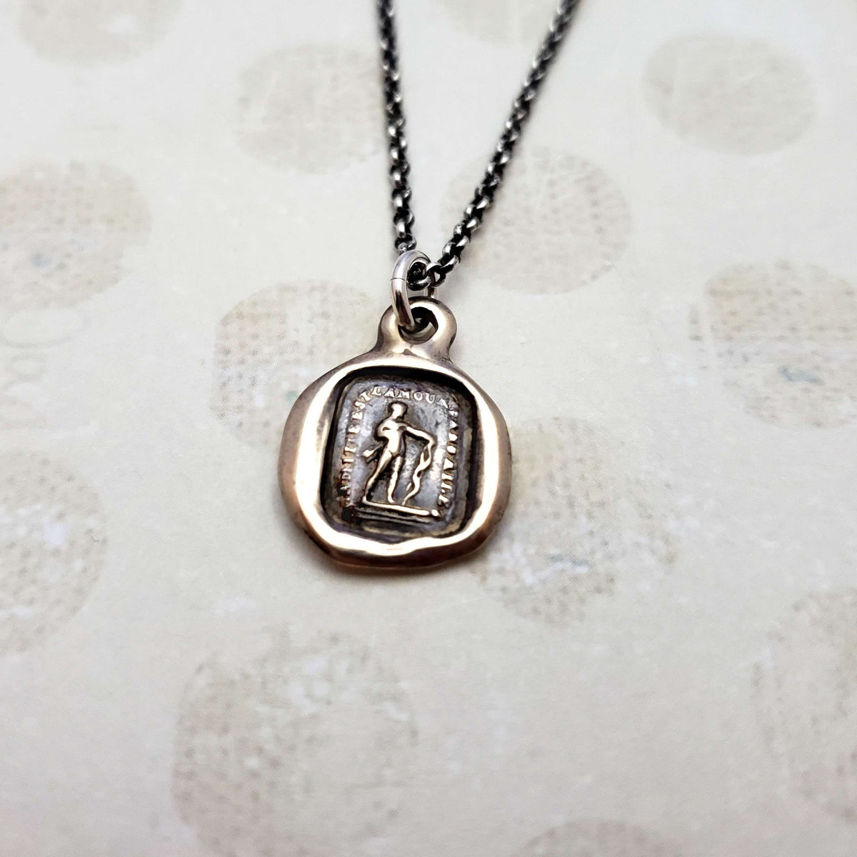 Friendship is love without his wings in bronze