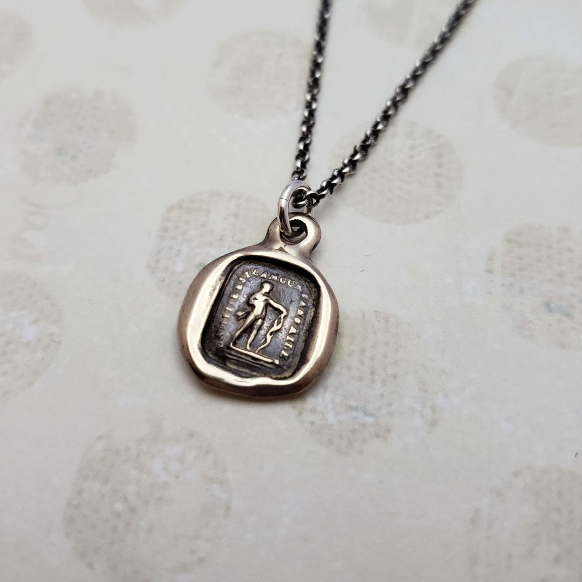 Friendship is love without his wings in bronze