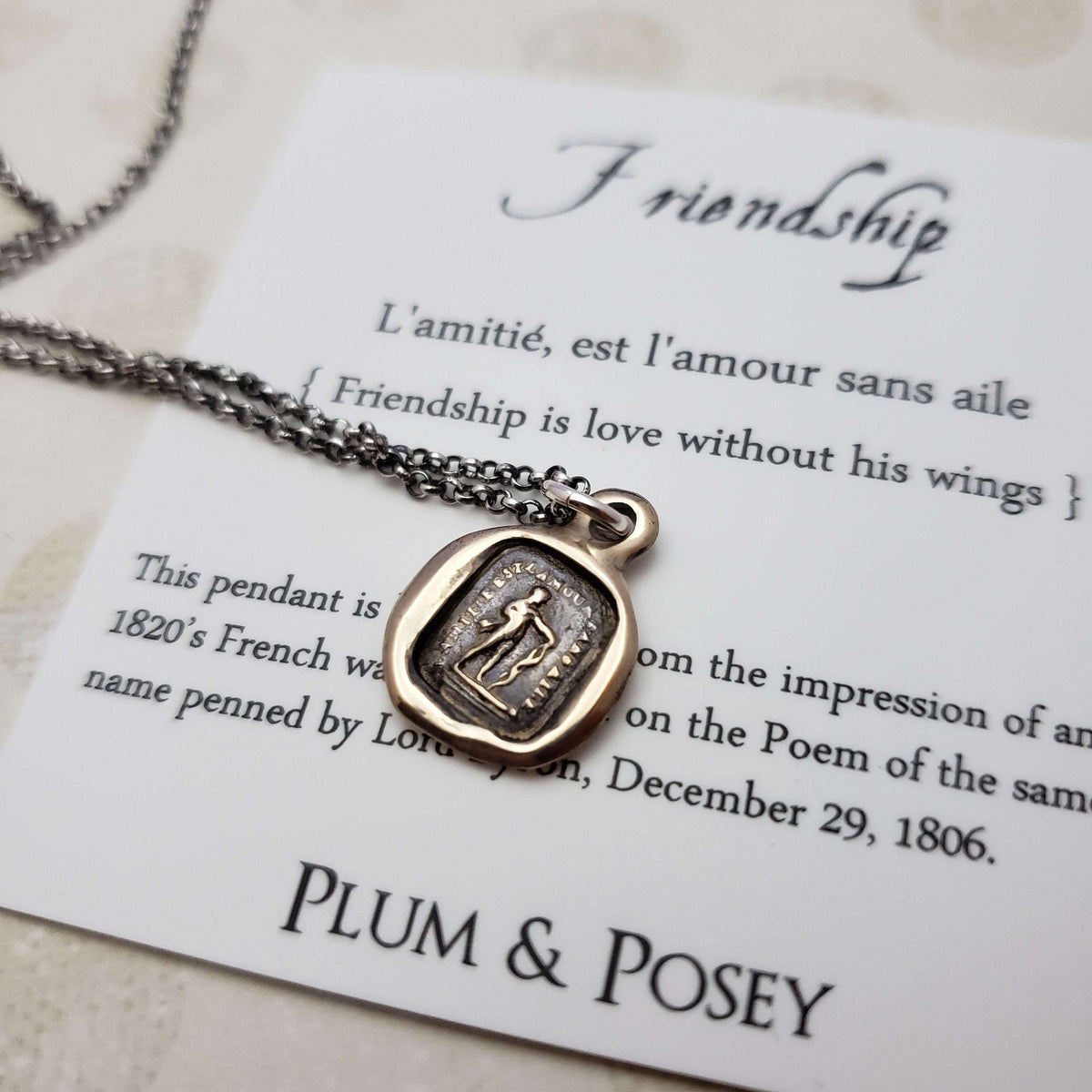 Friendship is love without his wings in bronze