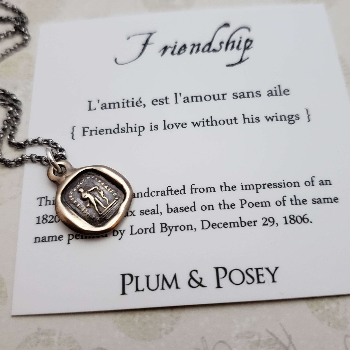 Friendship is love without his wings in bronze