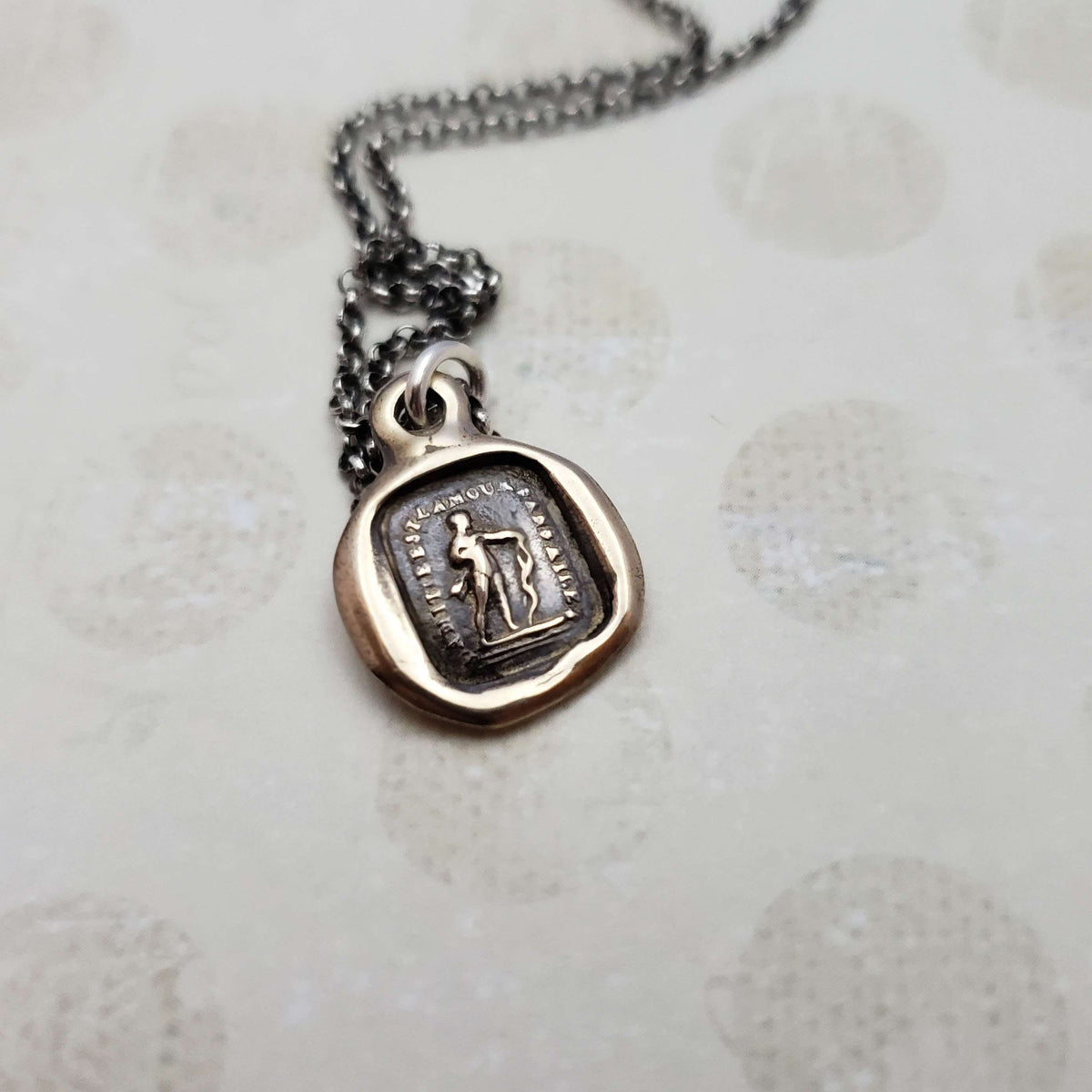 Friendship is love without his wings in bronze