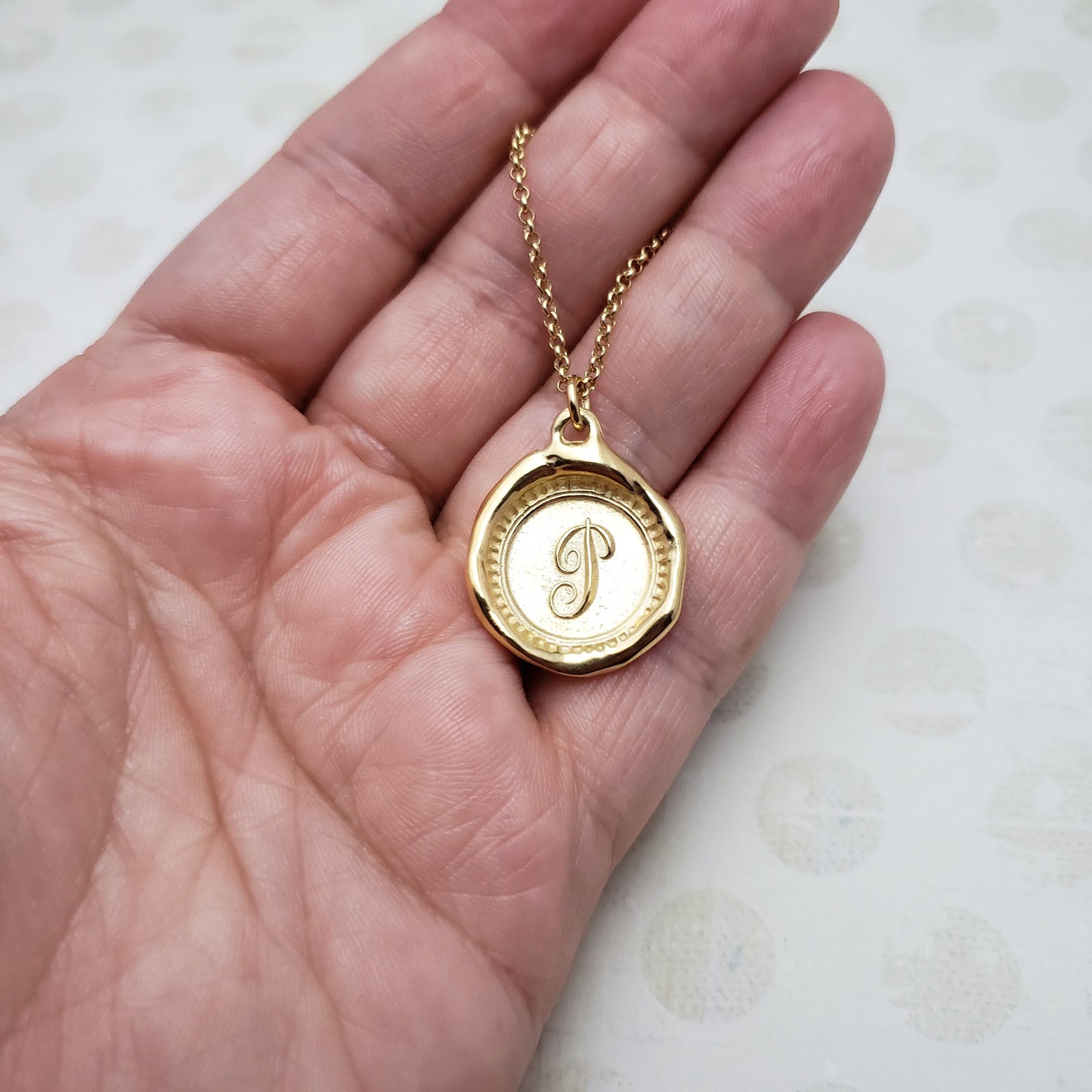 Letter P in gold vermeil