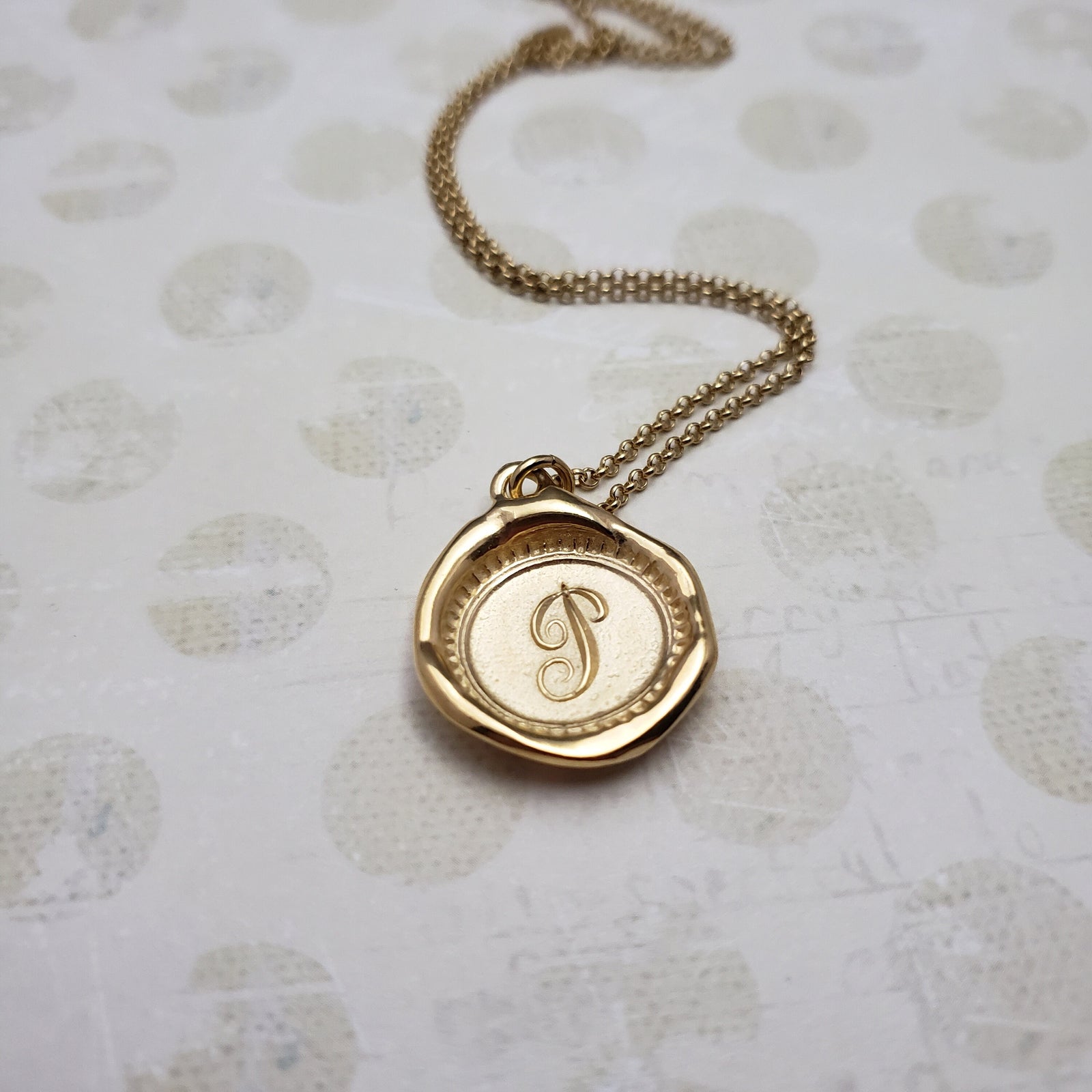Letter P in gold vermeil