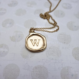 Letter W in gold vermeil