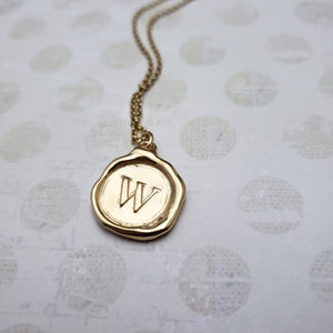 Letter W in gold vermeil