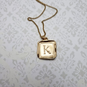 Letter K in gold vermeil