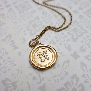 Letter N in gold vermeil