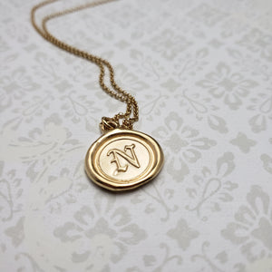 Letter N in gold vermeil