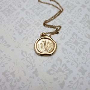 Letter I in gold vermeil