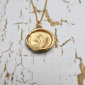 Letter F in gold vermeil
