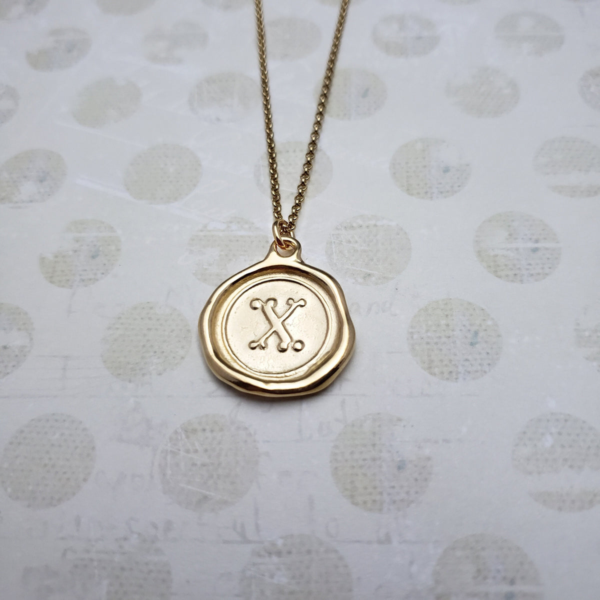 Letter X in gold vermeil