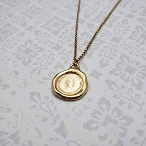 Letter O in gold vermeil
