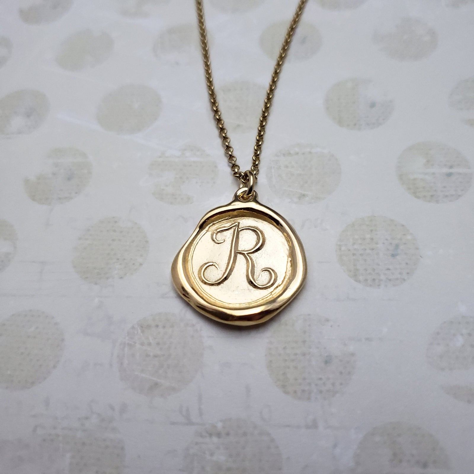 Letter R in gold vermeil