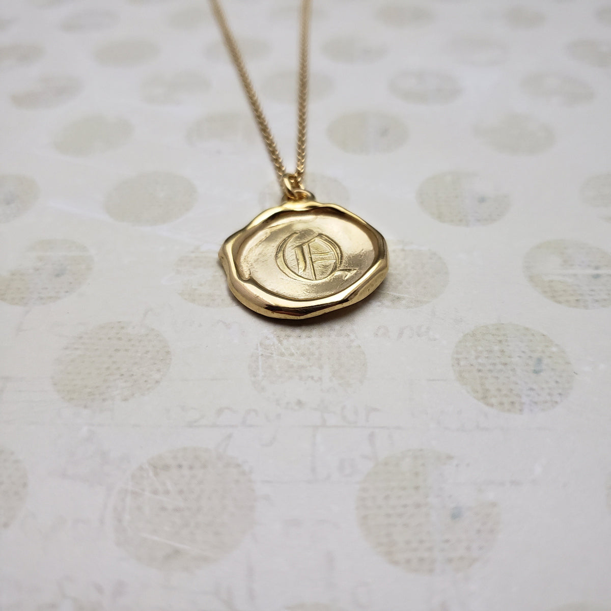 Letter Q in gold vermeil