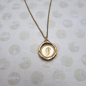 Letter P in gold vermeil