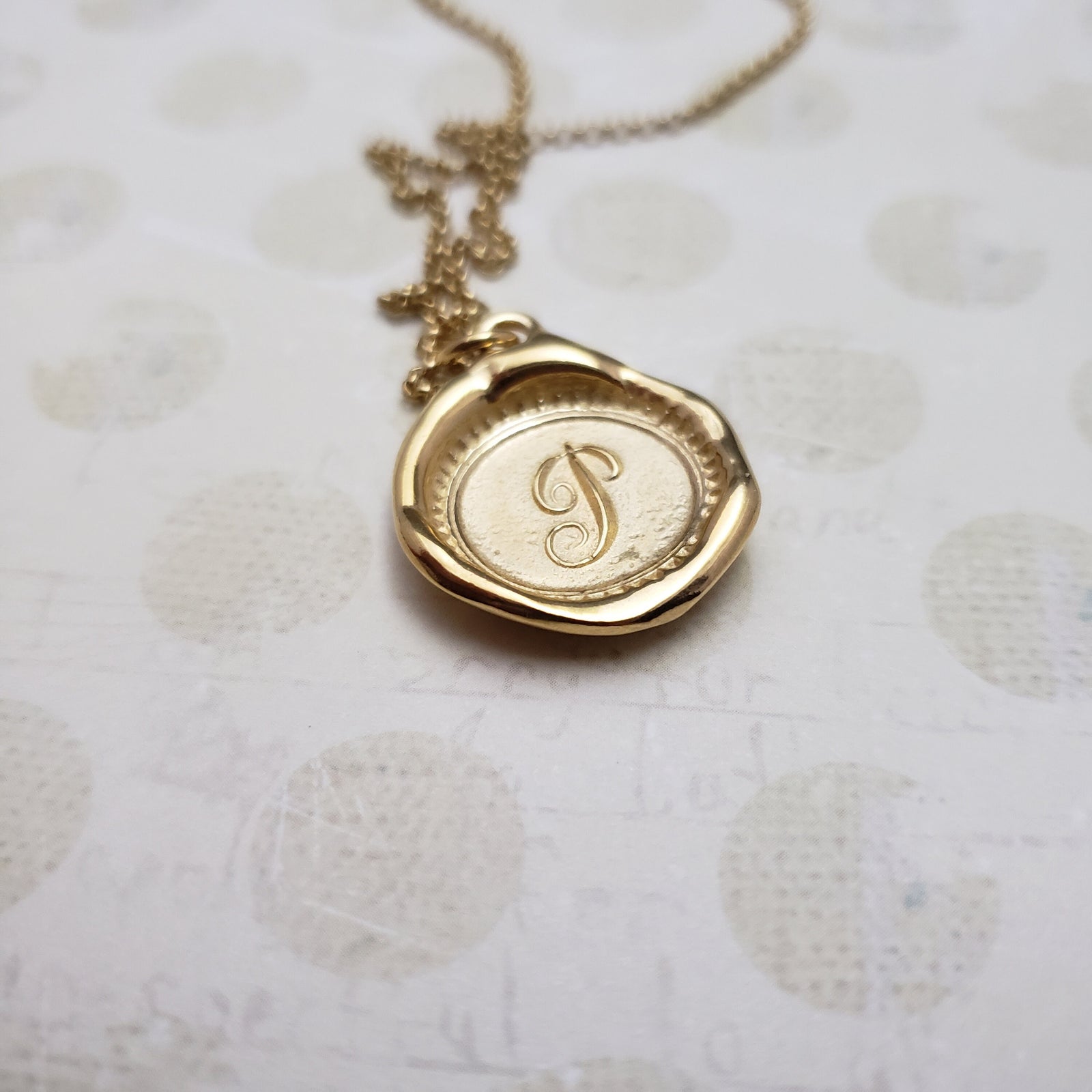 Letter P in gold vermeil
