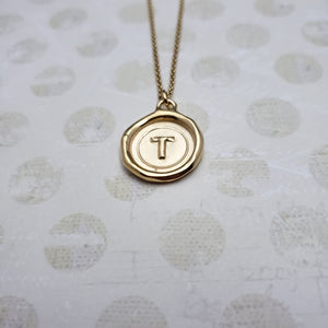 Letter T in gold vermeil