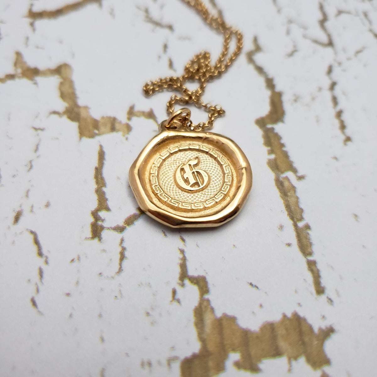 Letter G in gold vermeil