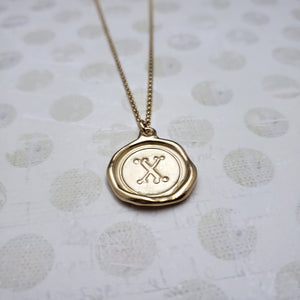 Letter X in gold vermeil
