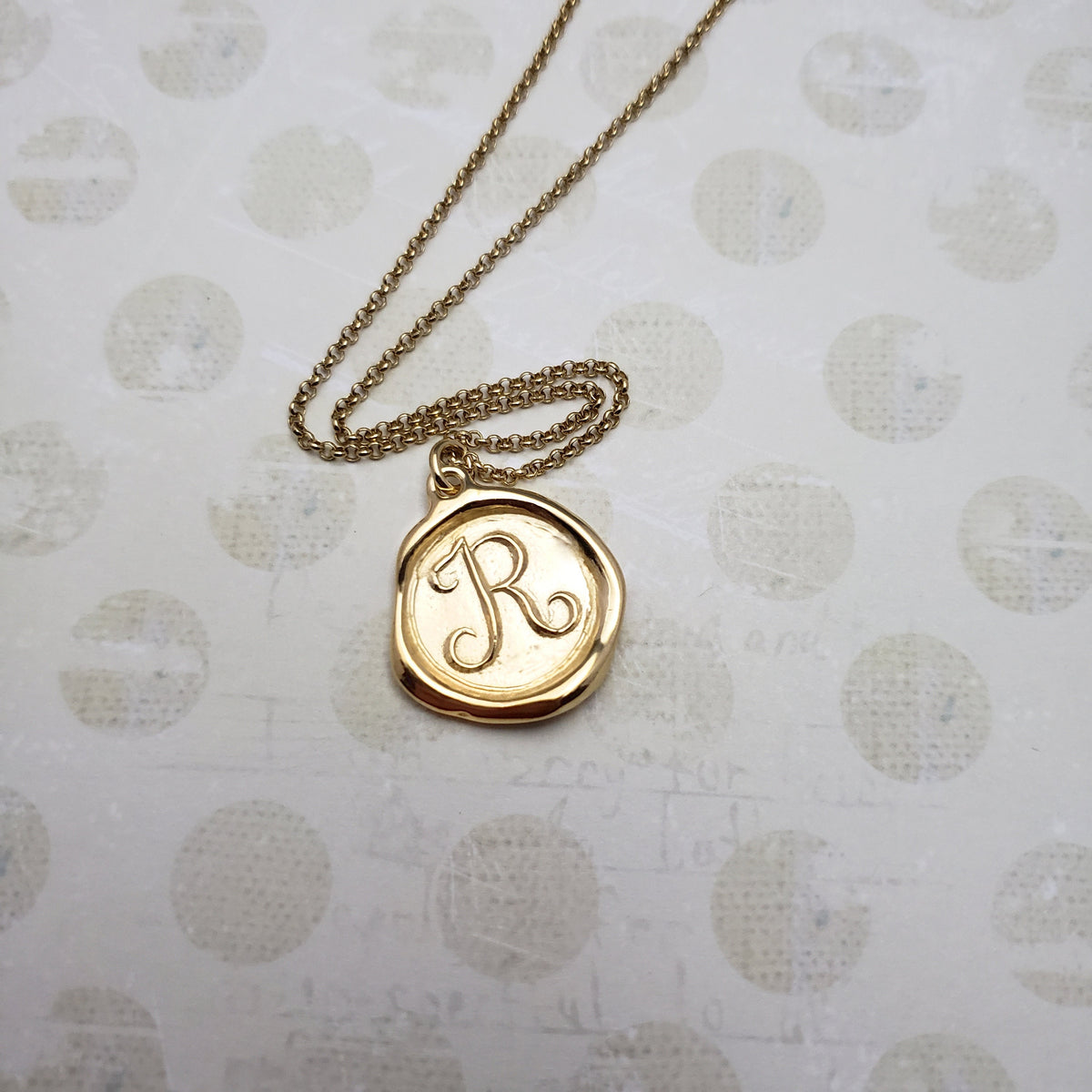 Letter R in gold vermeil