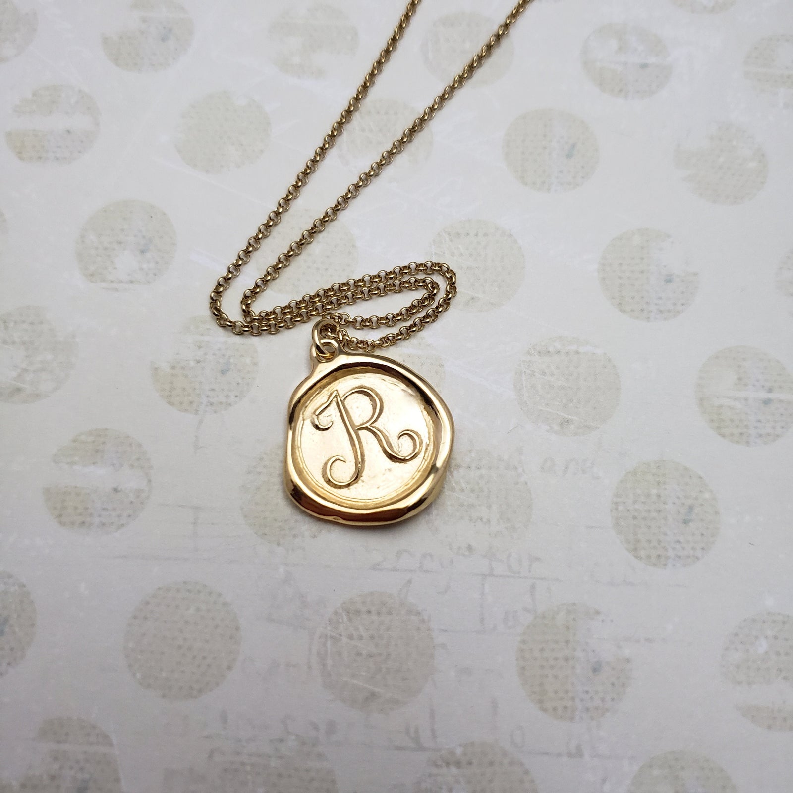 Letter R in gold vermeil