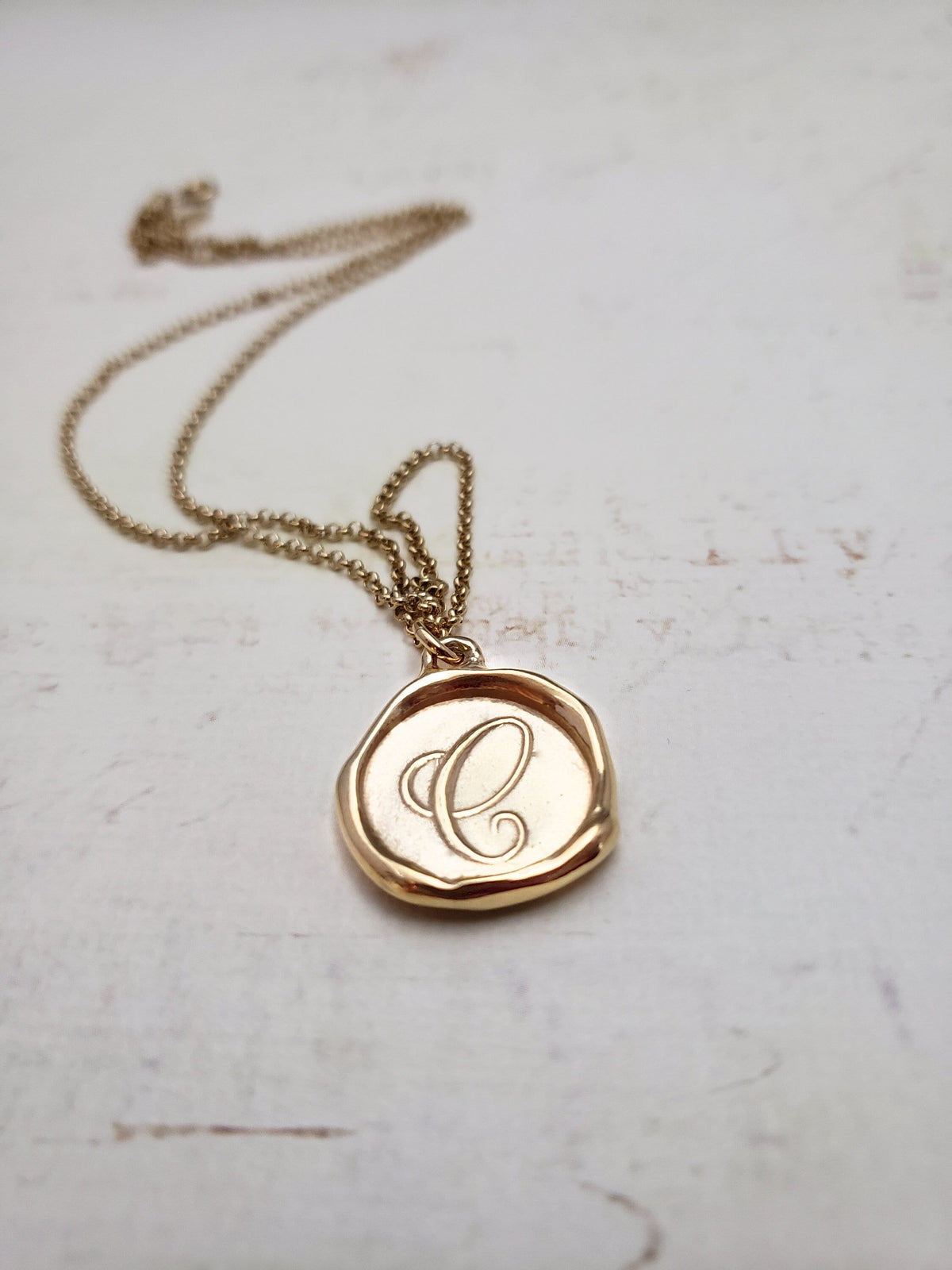 Letter C in gold vermeil