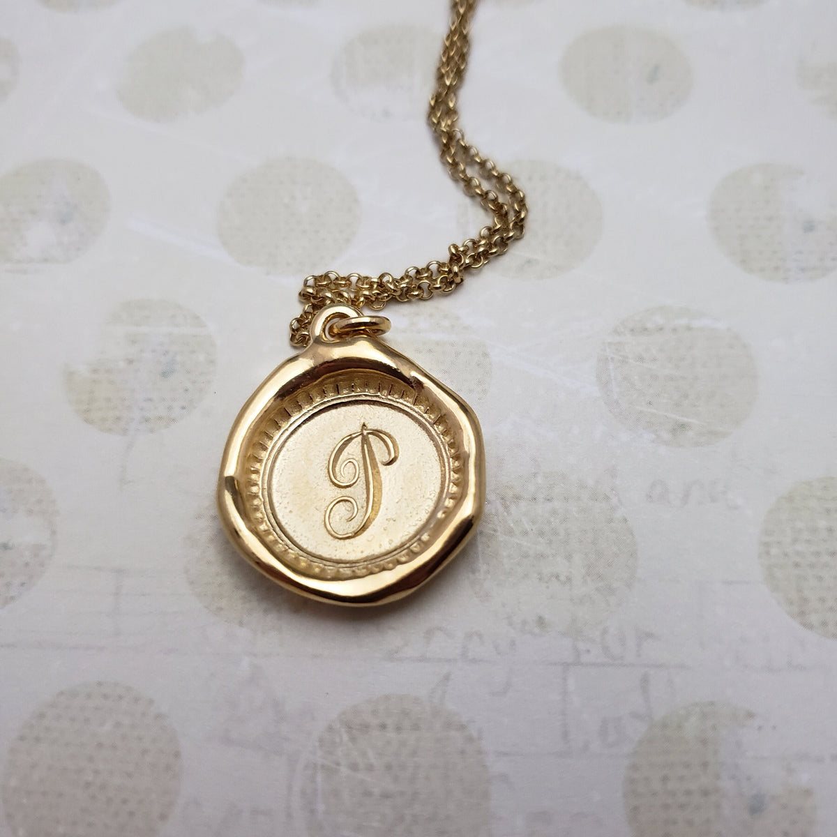 Letter P in gold vermeil