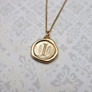 Letter I in gold vermeil